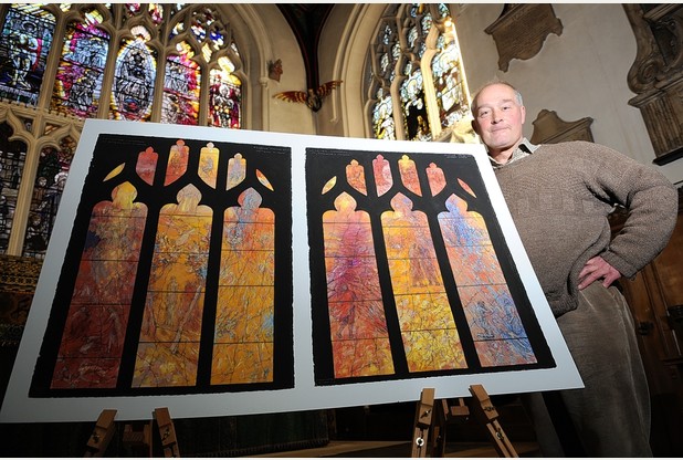 Artist Tom Denny with the stained glass window design revealed today 