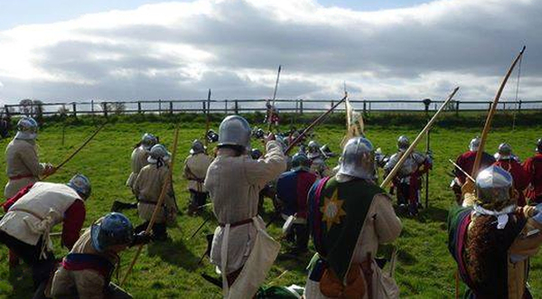 Towton Battlefield Society re-enacting the death of Clifford at Dintingdale